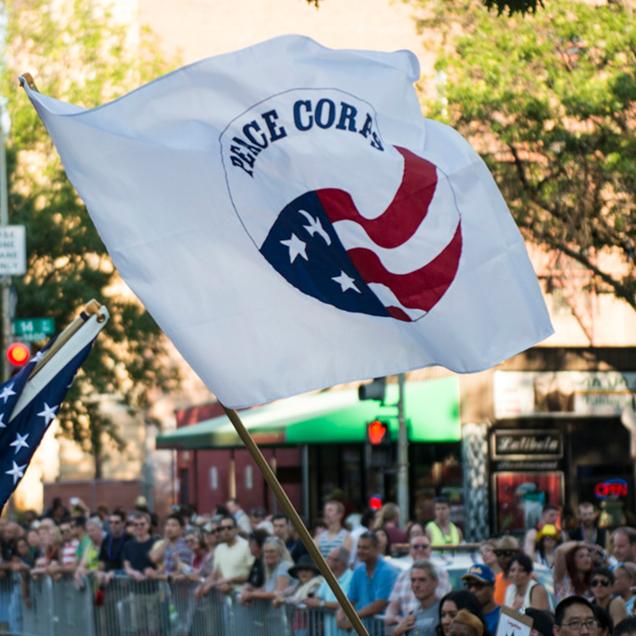 Rutgers Global – Peace Corps, Peace Corps flag waving during a large street fair event in Washington, DC