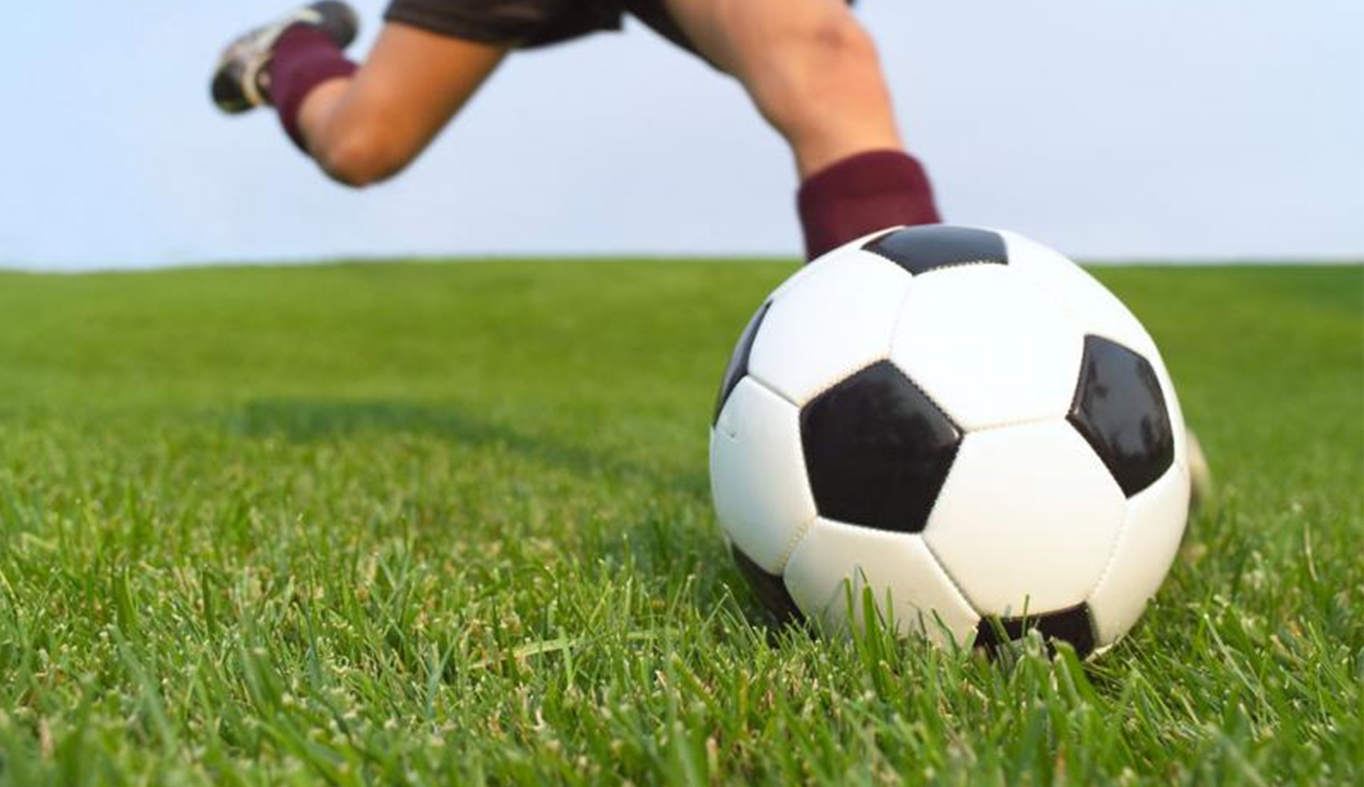 Rutgers Global - IFP Soccer Game 2018, kicking soccer ball on grass