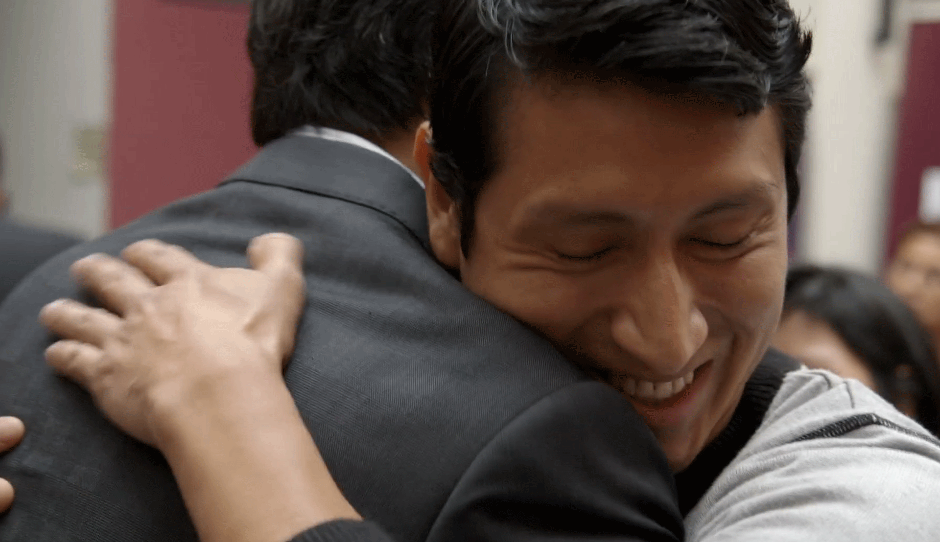 Rutgers Global - Bending the Arc Film Screening, screenshot of two men hugging