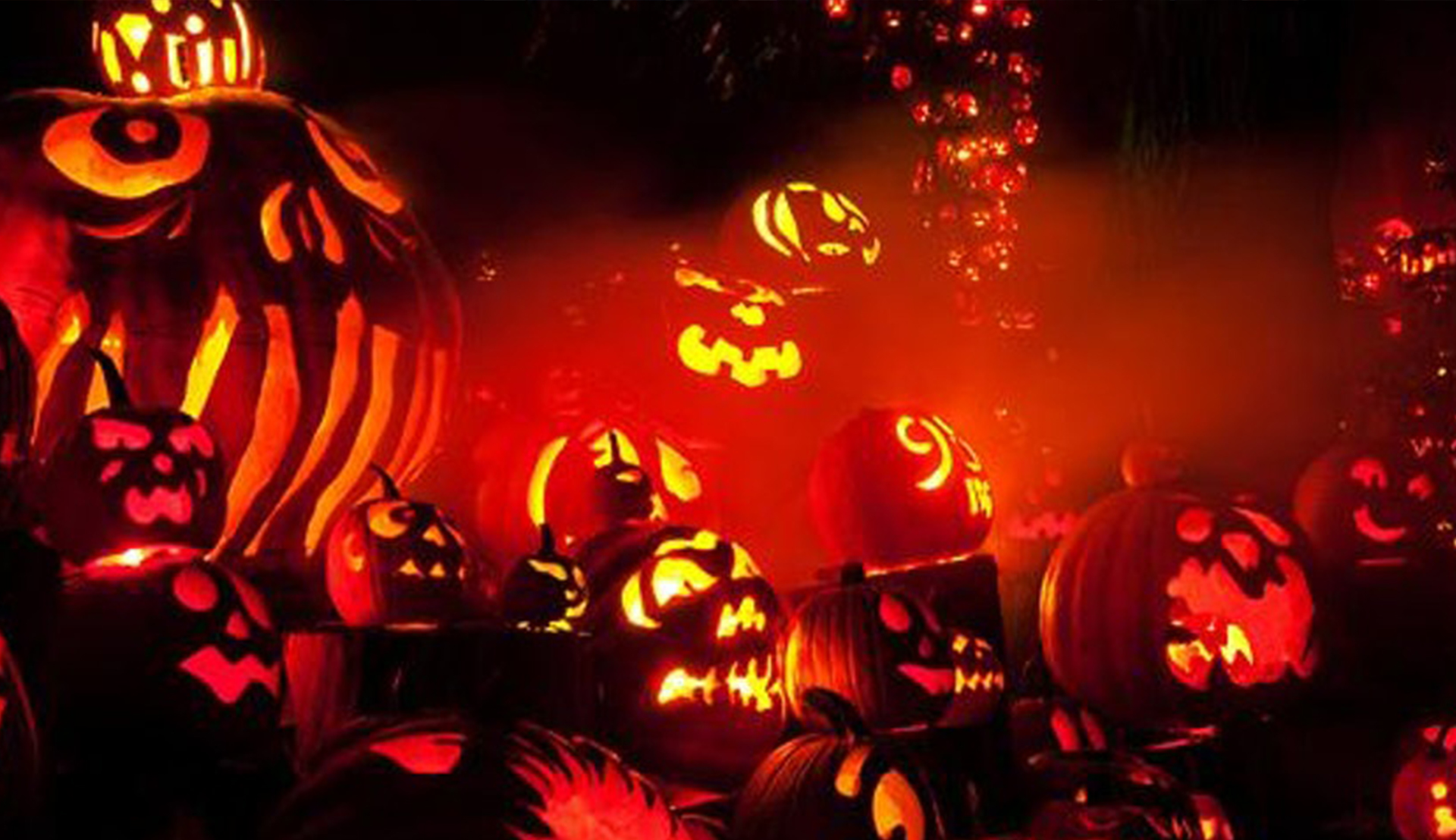 Rutgers Global-Global Ghouls Gala, series of lit Jack-o-lanterns with various carvings