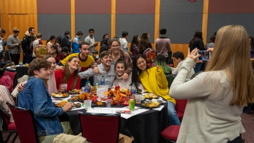 people taking group photos at a gathering