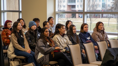 students sit in a lecture gall