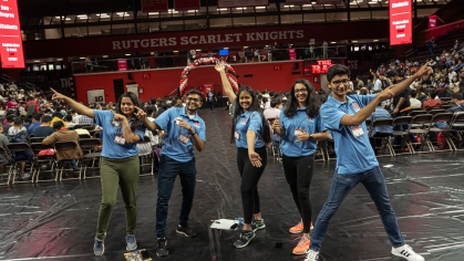 Rutgers international students at basketball arena