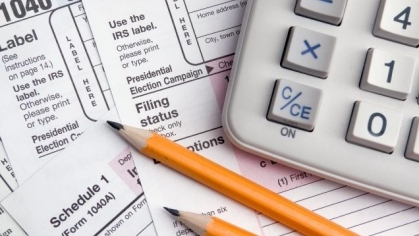 Stock image with tax forms, calculator, pencils