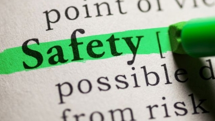 Text in a book with word safety highlighted in green
