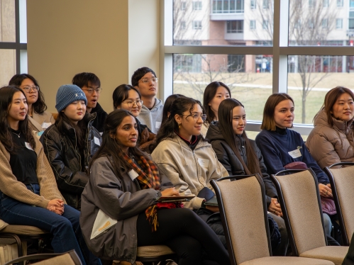 students sit in a lecture gall