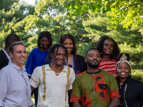 a group of people standing in the woods