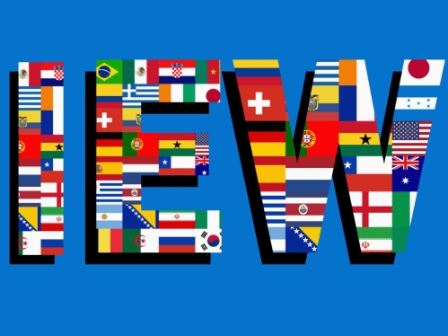 Letters “IEW” filled with various international flags