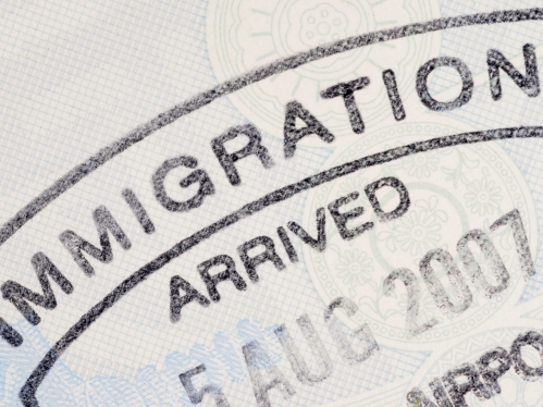 Passport immigration stamp on the inside page of a passport